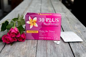 30 Plus NuWoman placed on a wooden bench