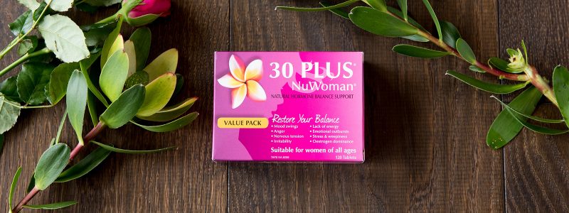 30 PLUS NuWoman Box on table with flowers