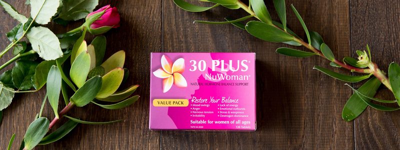 30 PLUS NuWoman Box on table with flowers