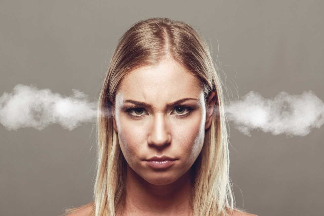 Woman with steam coming out of her ears